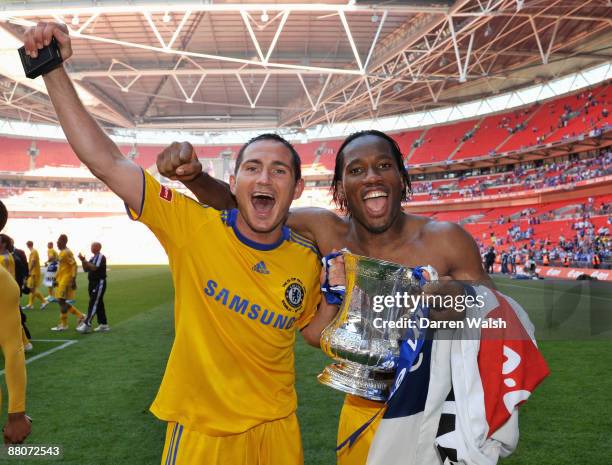 Frank Lampard and Didier Drogba of Chelsea celebrate with the trophy after the FA Cup sponsored by E.ON Final match between Chelsea and Everton at...