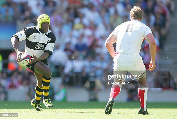 Serge Betsen of the Barbarians runs at England's Jerry Collins during the international friendly match played between England and the Barbarians at...