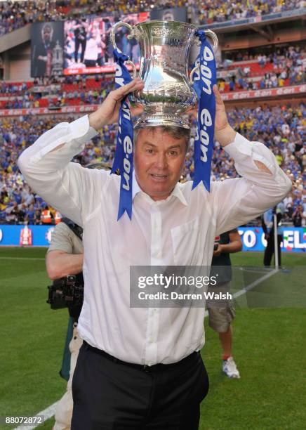 Chelsea Manager Guus Hiddink lifts the trophy after the FA Cup sponsored by E.ON Final match between Chelsea and Everton at Wembley Stadium on May...