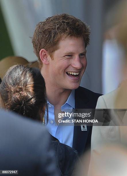 Prince Harry talks with guests before playing in the second annual Veuve Clicquot Manhattan Polo Classic May 30, 2009 on Governors Island at the...