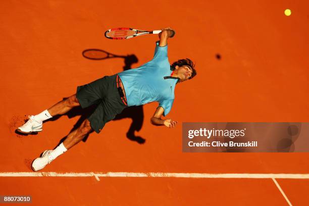 Roger Federer of Switzerland serves during the Men's Third Round match against Paul-Henri Mathieu of France on day seven of the French Open at Roland...