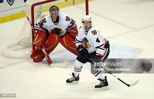 Goalie Cristobal Huet and Niklas Hjalmarsson of the Chicago Blackhawks defend against the Detroit Red Wings during Game Five of the Western...