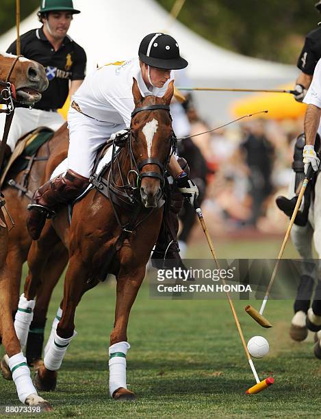 Prince Harry plays in the second annual Veuve Clicquot Manhattan Polo Classic May 30, 2009 on Governors Island, the final event of a two-day official...