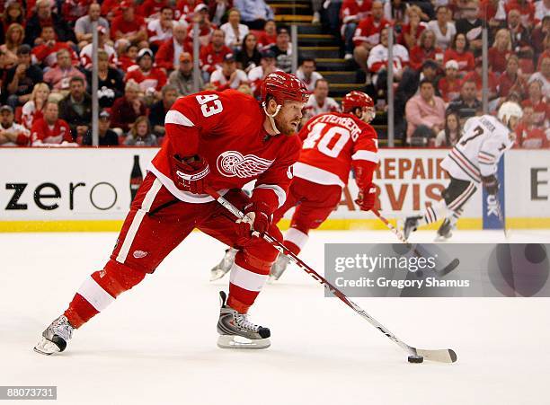 Johan Franzen of the Detroit Red Wings skates with the puck against the Chicago Blackhawks during Game Five of the Western Conference Championship...