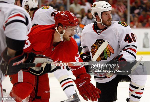 Darren Helm of the Detroit Red Wings looks down ice along with Colin Fraser of the Chicago Blackhawks during Game Five of the Western Conference...