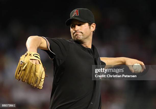 Starting pitcher Doug Davis of the Arizona Diamondbacks pitches against the Atlanta Braves during the major league baseball game at Chase Field on...