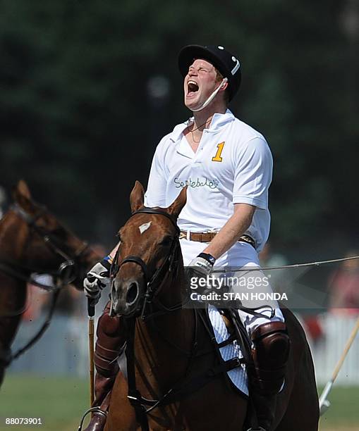 Prince Harry reacts as he plays in the second annual Veuve Clicquot Manhattan Polo Classic May 30, 2009 on Governors Island at the final event of a...