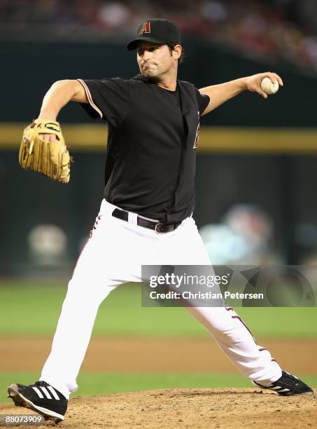 Starting pitcher Doug Davis of the Arizona Diamondbacks pitches against the Atlanta Braves during the major league baseball game at Chase Field on...