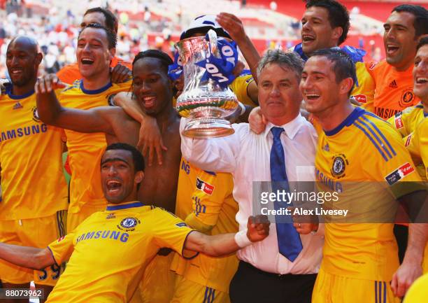 Chelsea manager Guus Hiddink and winning goalscorer Frank Lampard celebrate with team mates after the FA Cup sponsored by E.ON Final match between...