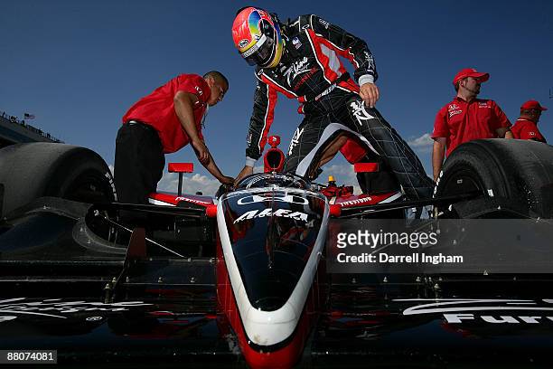 Justin Wilson climbs aboard the Z-Line Design Dale Coyne Racing Dallara Honda during practice for the IRL IndyCar Series ABC Supply/A.J.Foyt 225 on...