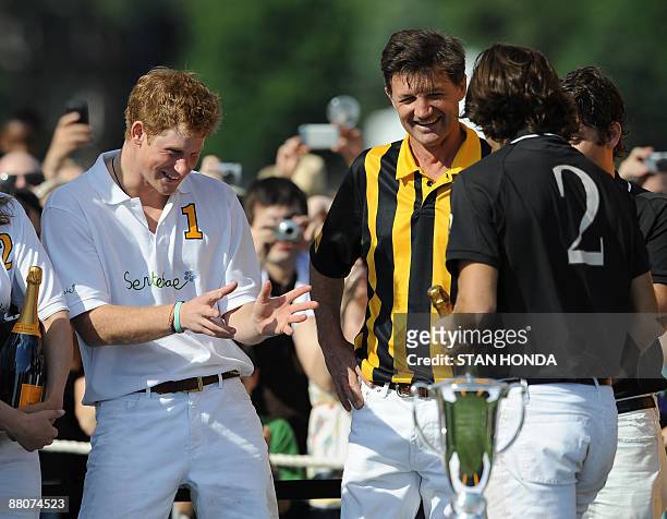 Prince Harry jokes with Nacho Figueras after playing in the second annual Veuve Clicquot Manhattan Polo Classic May 30, 2009 on Governors Island at...
