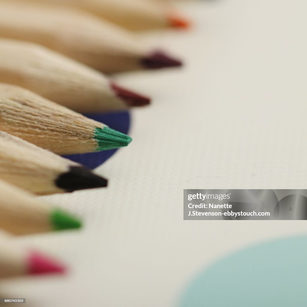 Colorful pencils on colorful background