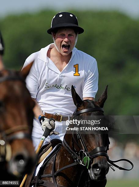 Prince Harry reacts while playing in the second annual Veuve Clicquot Manhattan Polo Classic May 30, 2009 on Governors Island at the final event of a...