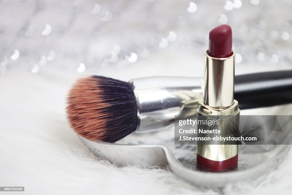 Closeup of makeupbrush and lipstick
