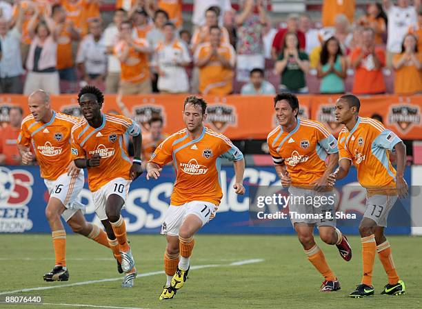 Brad Davis of the Houston Dynamo celebrates his goal with teammates against the Toronto FC at Robertson Stadium on May 30, 2009 in Houston, Texas.