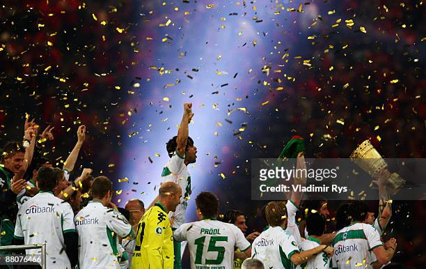 Torsten Frings of Bremen lifts the trophy infront of team mate Diego after winning the DFB Cup Final match between Bayer 04 Leverkusen and SV Werder...