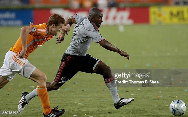 Andrew Hainault of the Houston Dynamo chases Marvell Wynne of Toronto FC at Robertson Stadium on May 30, 2009 in Houston, Texas.