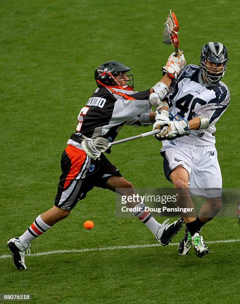 Hunter Lochte of the Washington Bayhawks takes a shot on goal past Casey Cittadino of the Denver Outlaws during Major League Lacrosse action at...