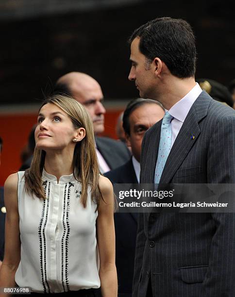 Spanish Crown Prince Felipe and his wife Princess Letizia during a visit to a library in a suburb neighbourhood of Medellin after participate of the...