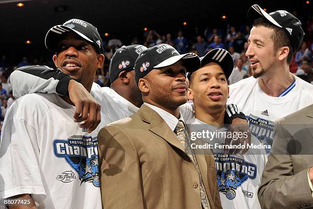 Rafer Alston, Jameer Nelson, Tyronn Lue and Hedo Turkoglu celebrate after the Orlando Magic defeated the Cleveland Cavaliers 103-90 in Game Six of...