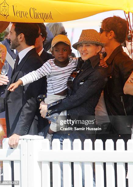 Marc Jacobs and Madonna with her son David watch the 2009 Veuve Clicquot Manhattan Polo Classic on Governor's Island on May 30, 2009 in New York City.