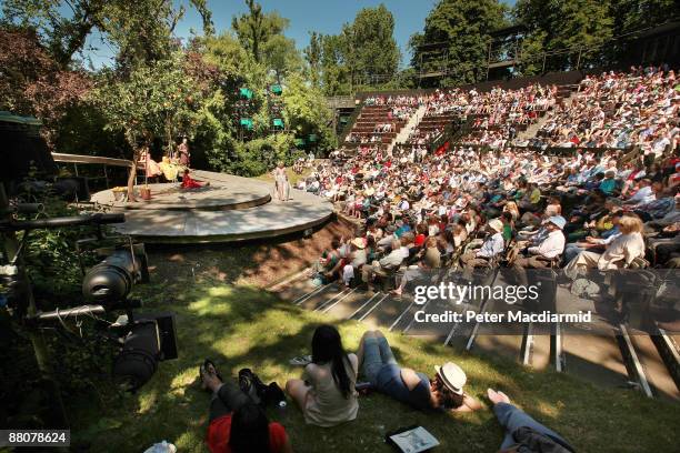 Matinee audience watch a production of Much Ado About Nothing at The Open Air Theatre on May 30, 2009 in Regents Park, London. Warm temperatures...