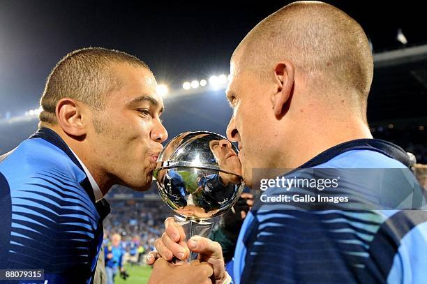 Bulls Bryan Habana and Jaco Pretorius kiss the trophy after the Super 14 final match between Vodacom Bulls and Chiefs at Loftus Versfeld Stadium on...