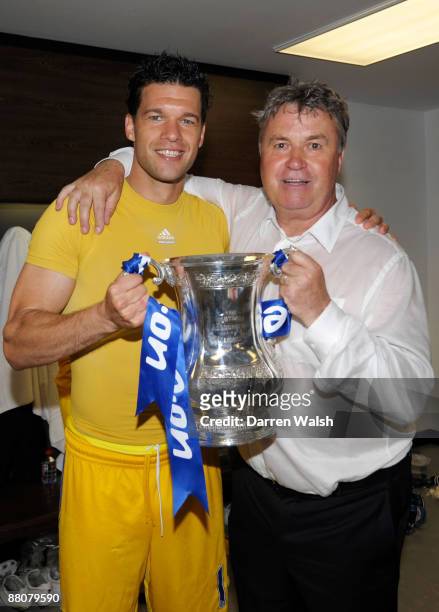 Michael Ballack and manager Guus Hiddink of Chelsea celebrate victory in the dressing room after the FA Cup sponsored by E.ON Final match between...