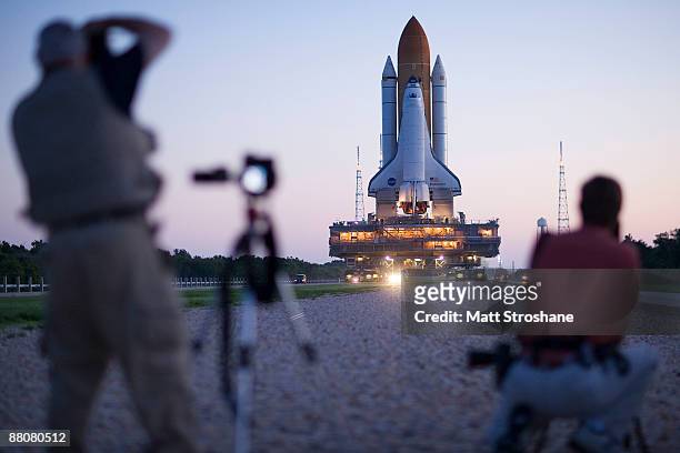 Space Shuttle Endeavour rolls atop the crawler transporter from launch pad 39-b to launch pad 39-a at Kennedy Space Center on May 31, 2009 in Cape...