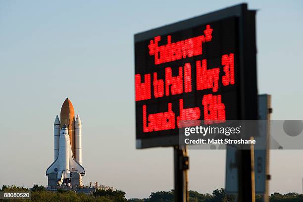 Space Shuttle Endeavour rolls atop the crawler transporter from launch pad 39-b to launch pad 39-a at Kennedy Space Center on May 31, 2009 in Cape...