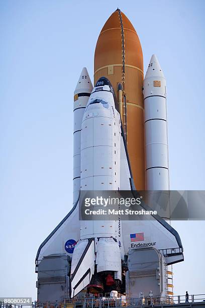 Space Shuttle Endeavour rolls atop the crawler transporter from launch pad 39-b to launch pad 39-a at Kennedy Space Center on May 31, 2009 in Cape...
