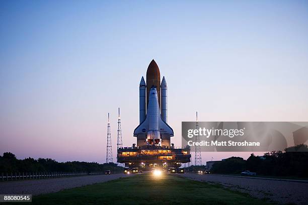 Space Shuttle Endeavour rolls atop the crawler transporter from launch pad 39-b to launch pad 39-a at Kennedy Space Center on May 31, 2009 in Cape...