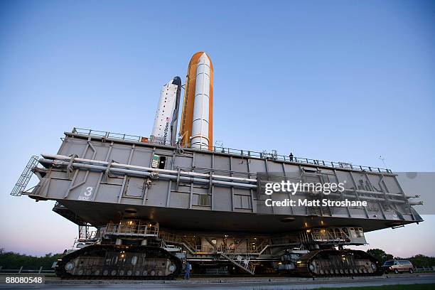 Space Shuttle Endeavour rolls atop the crawler transporter from launch pad 39-b to launch pad 39-a at Kennedy Space Center on May 31, 2009 in Cape...