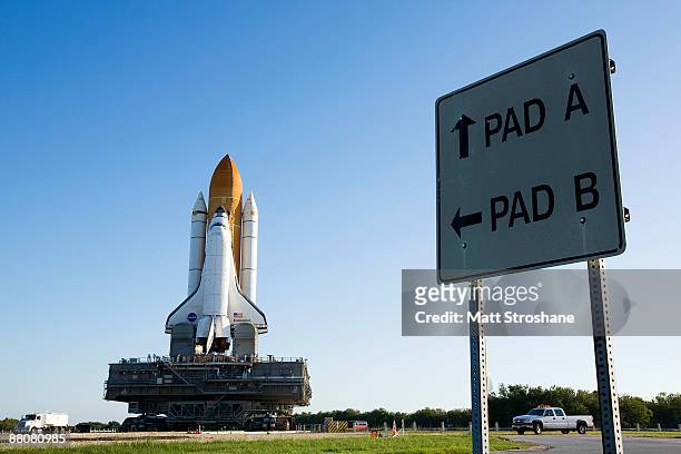 Space Shuttle Endeavour rolls atop the crawler transporter from launch pad 39-b to launch pad 39-a at Kennedy Space Center in Cape Canaveral,...