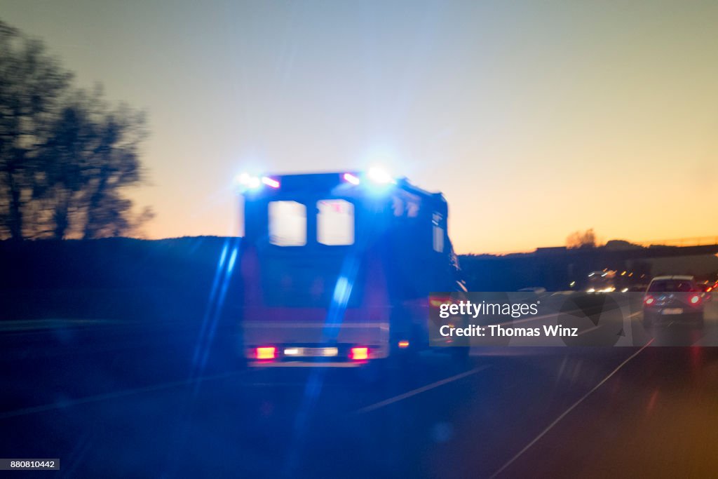 Ambulance on Freeway at Dusk