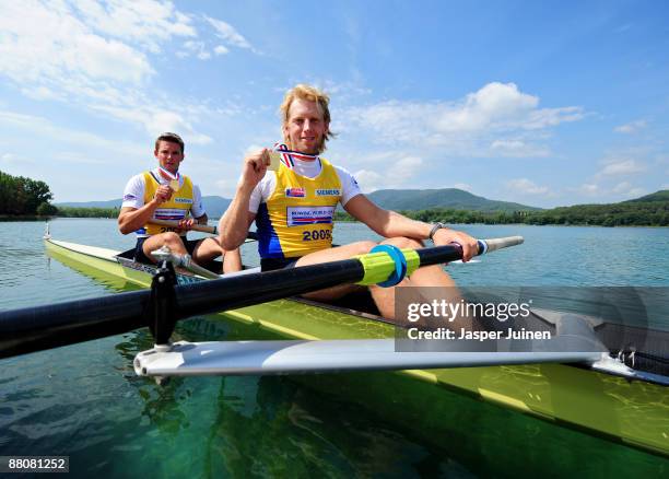 Andy Hodge Triggs and Peter Reed of Great Britain hold up their gold medals after winning the Men's Pair final race on day three of the FISA Rowing...