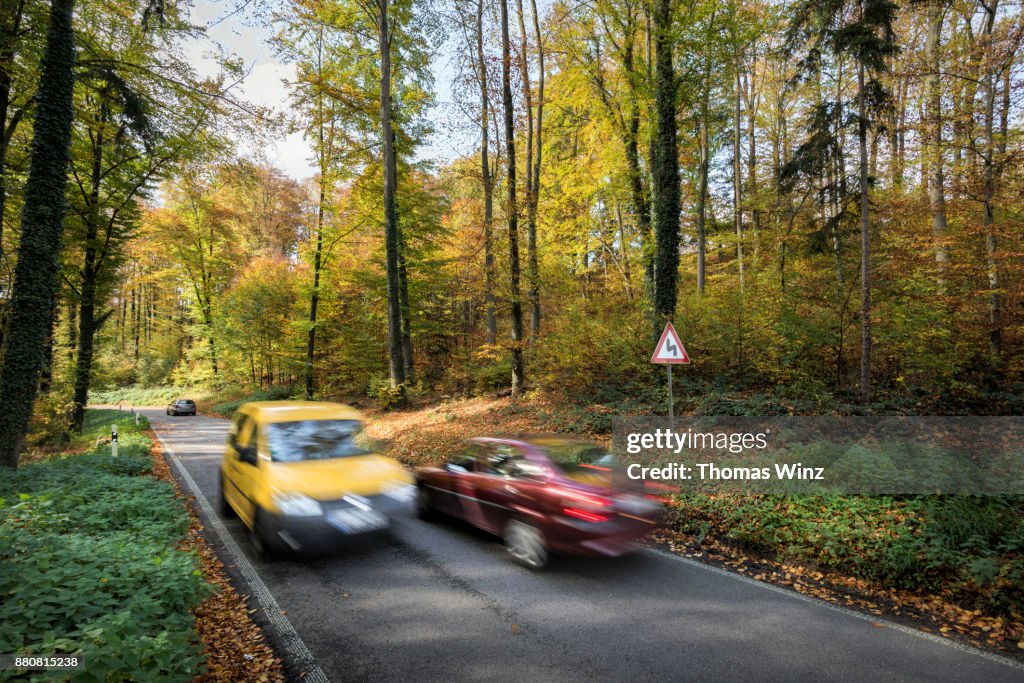 Two cars passing each other , Country road