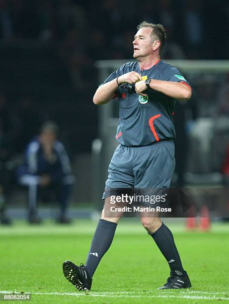 Referee Helmut Fleischer ia seen during the DFB Cup Final match between Bayer Leverkusen and Werder Bremen at the Olympic stadium on May 30, 2009 in...