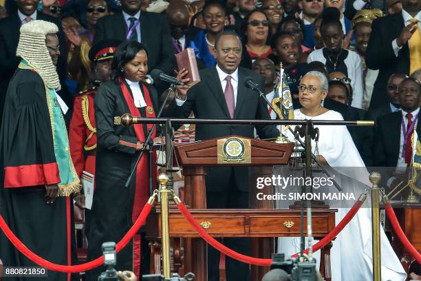 Kenya's President Uhuru Kenyatta takes oath of office during his inauguration ceremony at Kasarani Stadium on November 28, 2017 in Nairobi. Kenyatta...