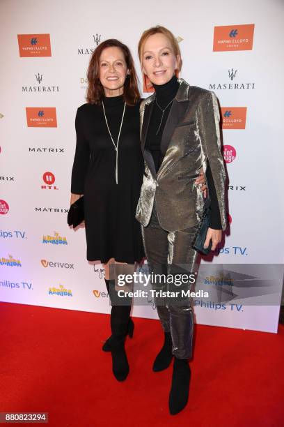 Angela Roy and Katja Flint, wearing a golden suit from Karl Lagerfeld, attend the Movie Meets Media event 2017 at Hotel Atlantic Kempinski on...