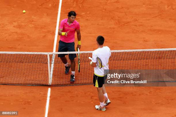 Robin Soderling of Sweden goes to shake hands with Rafael Nadal of Spain following his victory during the Men's Singles Fourth Round match on day...