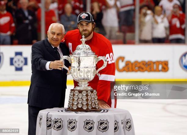 Henrik Zetterberg of the Detroit Red Wings recieves the Clarence S. Campbell Bowl from NHL Senior Vice President of Hockey Operations Jim Gregory...