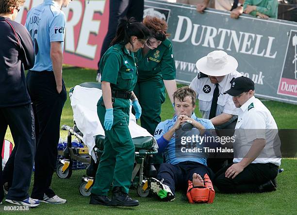 Chris Nash of Sussex is treated by an ambulance crew after sustaining an ankle injury in a collision with team mate Dwayne Smith during the Twenty20...