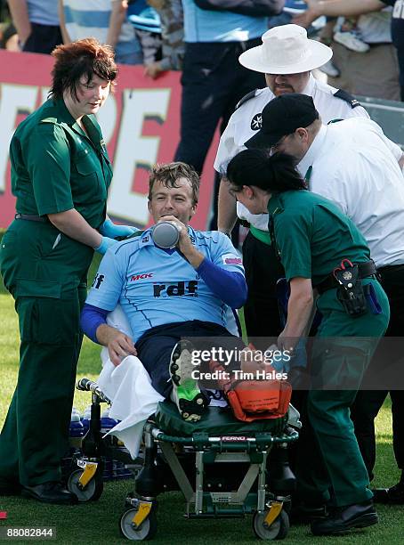 Chris Nash of Sussex is taken away by ambulance after sustaining an ankle injury in a collision with team mate Dwayne Smith during the Twenty20 Cup...