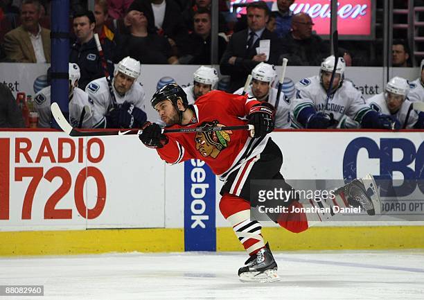 Brent Seabrook of the Chicago Blackhawks follows through on a shot attempt against the Vancouver Canucks during Game Six of the Western Conference...