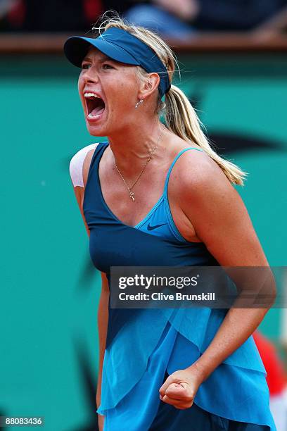 Maria Sharapova of Russia celebrates a point during the Women's Singles Fourth Round match against Na Li of China on day eight of the French Open at...