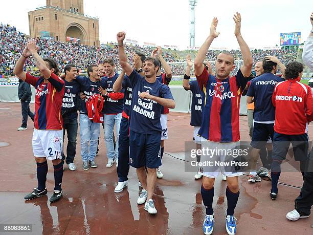 Nicola Mingazzini, Davide Marchini and Bologna FC players celebrate for remaining in A category after winning 3:1 their Serie A match against Calcio...