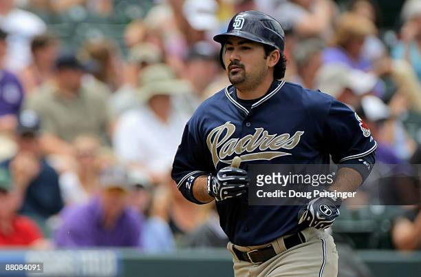 Adrian Gonzalez of the San Diego Padres rounds the bases on his third inning three run homerun off of starting pitcher Jorge De La Rosa of the...