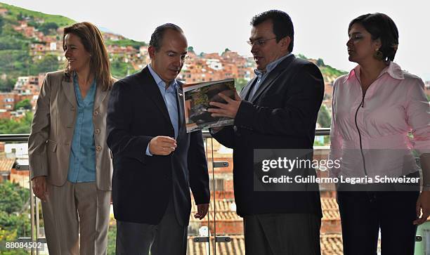 Mexican First Lady Margarita Zavala, Mexican President Felipe Calderon, Medellin's Mayor Alonso Salazar and Medellin Mayor's wife Marta Liliana talk...