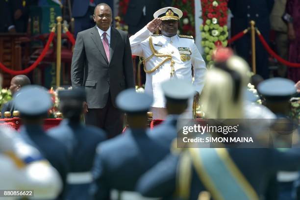 Kenya's President Uhuru Kenyatta views the past out parade before taking oath of office during his inauguration ceremony at Kasarani Stadium on...